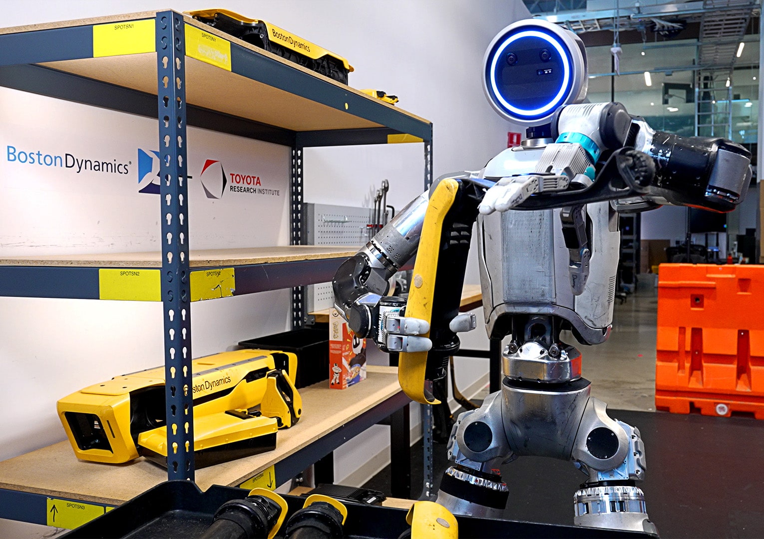 The Atlas folds a leg from a Spot robot