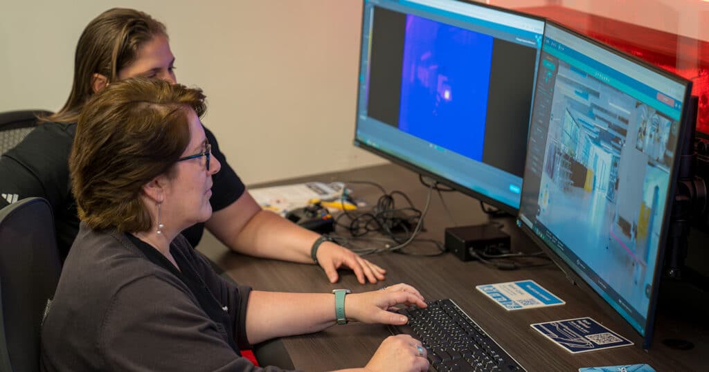 A learner completes online course work via Boston Dynamics University