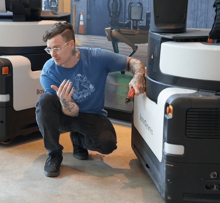 Jonathon Streker shows of the Stretch robot in Boston Dynamics' demo lab